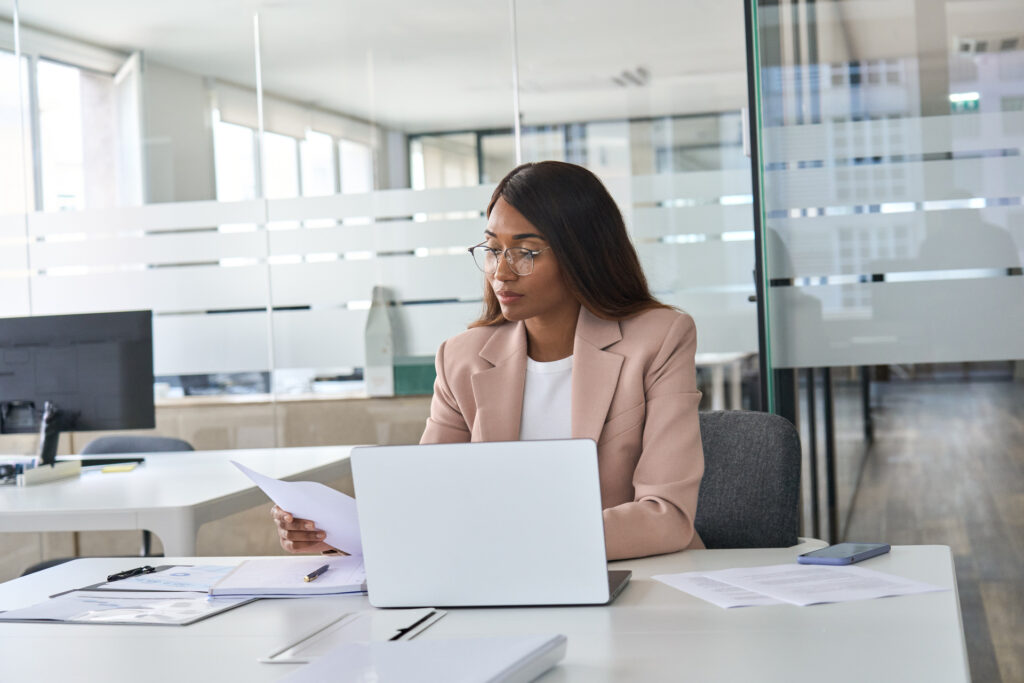 busy young business woman executive reading papers